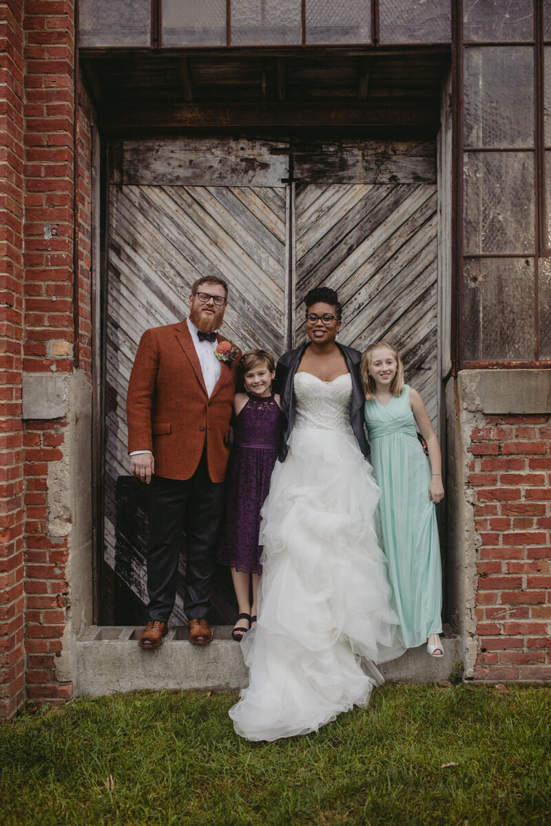 Newly wed couple with kids after ceremony in Baltimore MD Carly Romeo photography