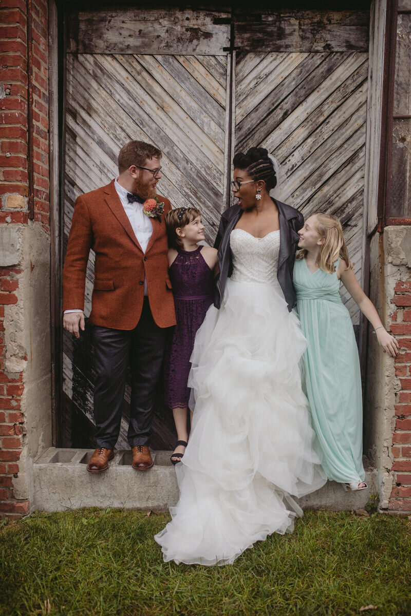 Newly wed couple with kids after ceremony in Baltimore MD Carly Romeo &amp; Co.