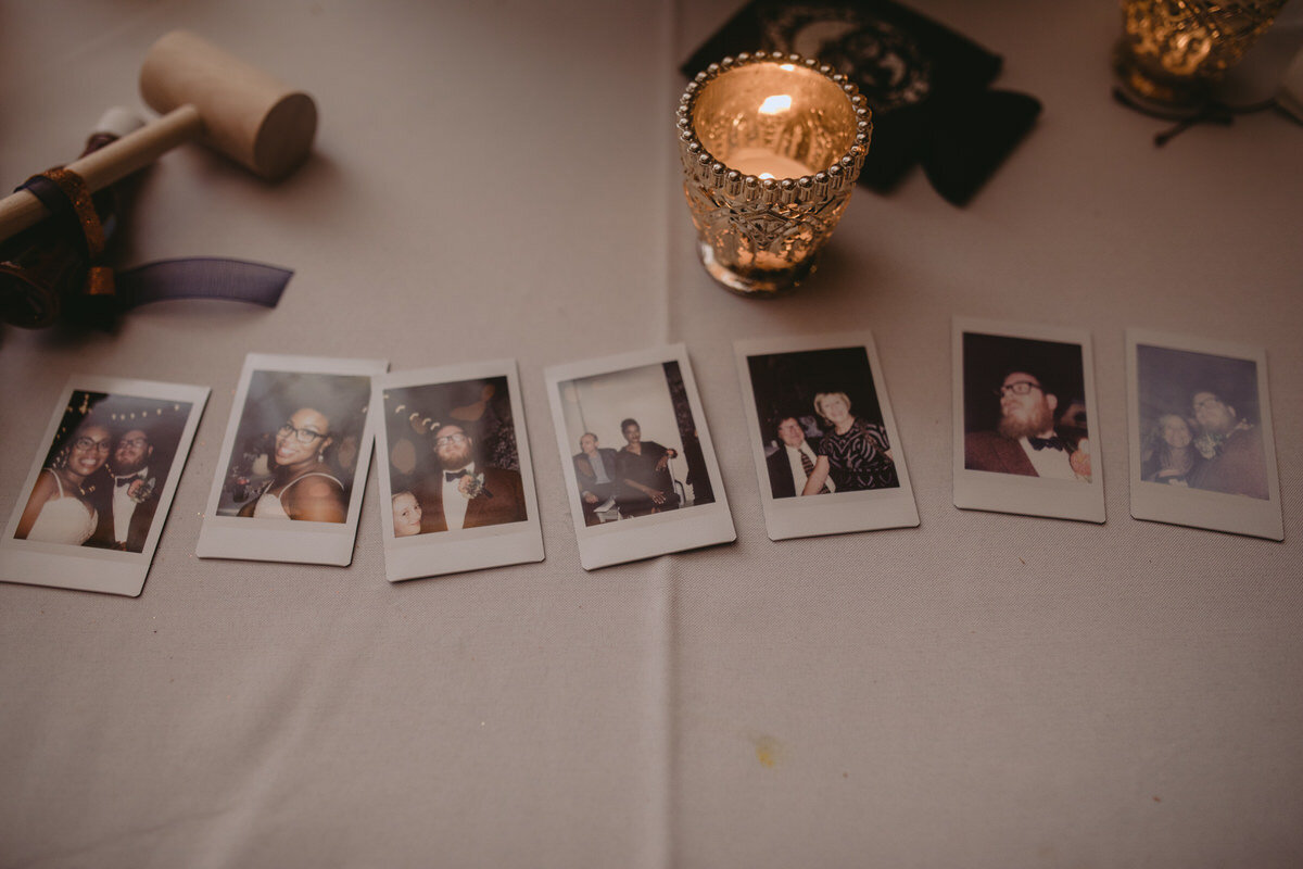 Polaroid photos at wedding reception in Corradetti Studio Baltimore Maryland Carly Romeo &amp; CO.
