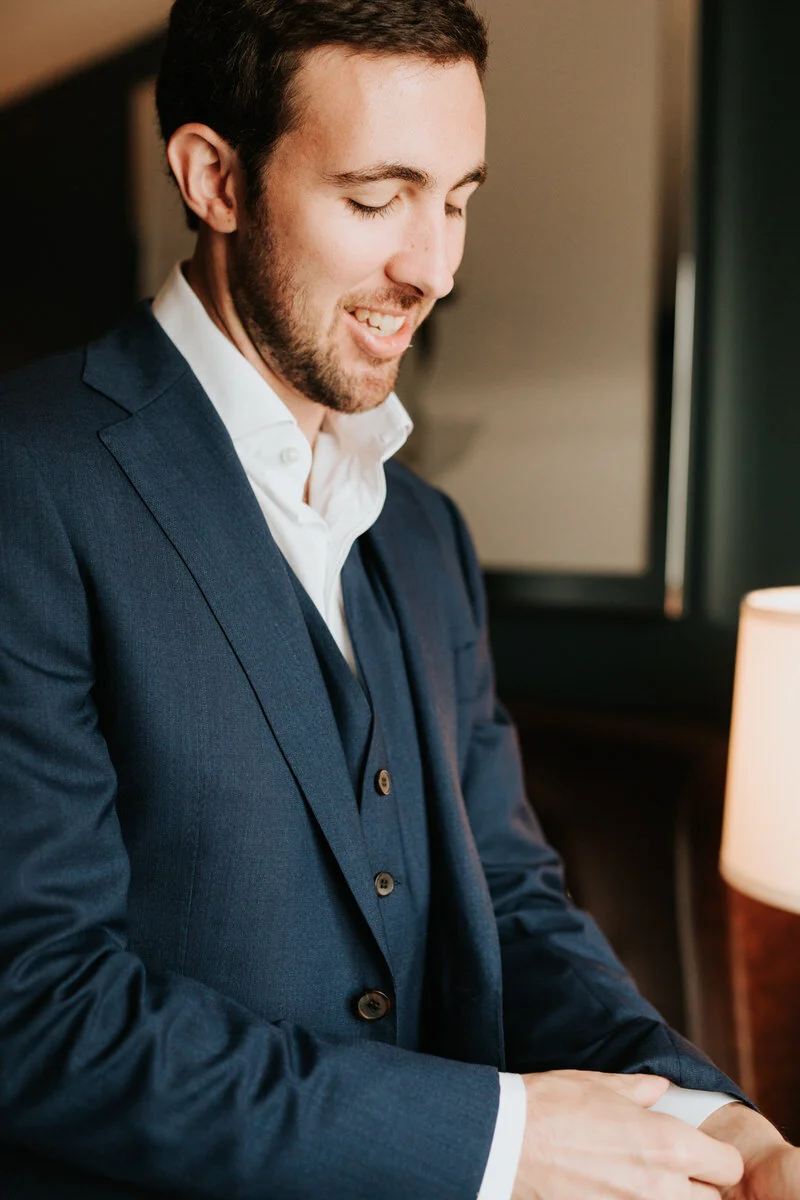 Groom smiling before wedding in Richmond VA Carly Romeo + Co.