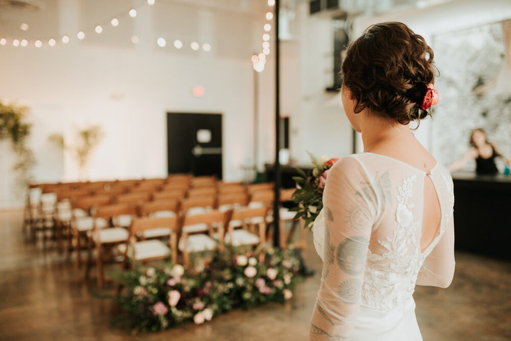 Bride looking at empty ceremony space at Studio Two Three Richmond VA Carly Romeo + Co.