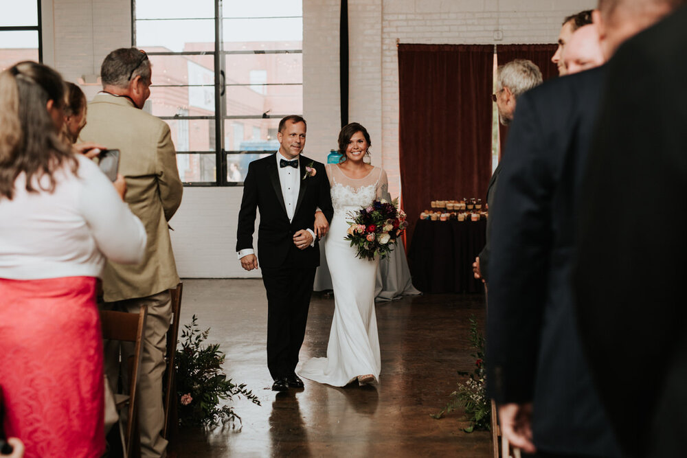 Bride and father walking down isle at Studio Two Three in Richmond Virginia Carly Romeo
