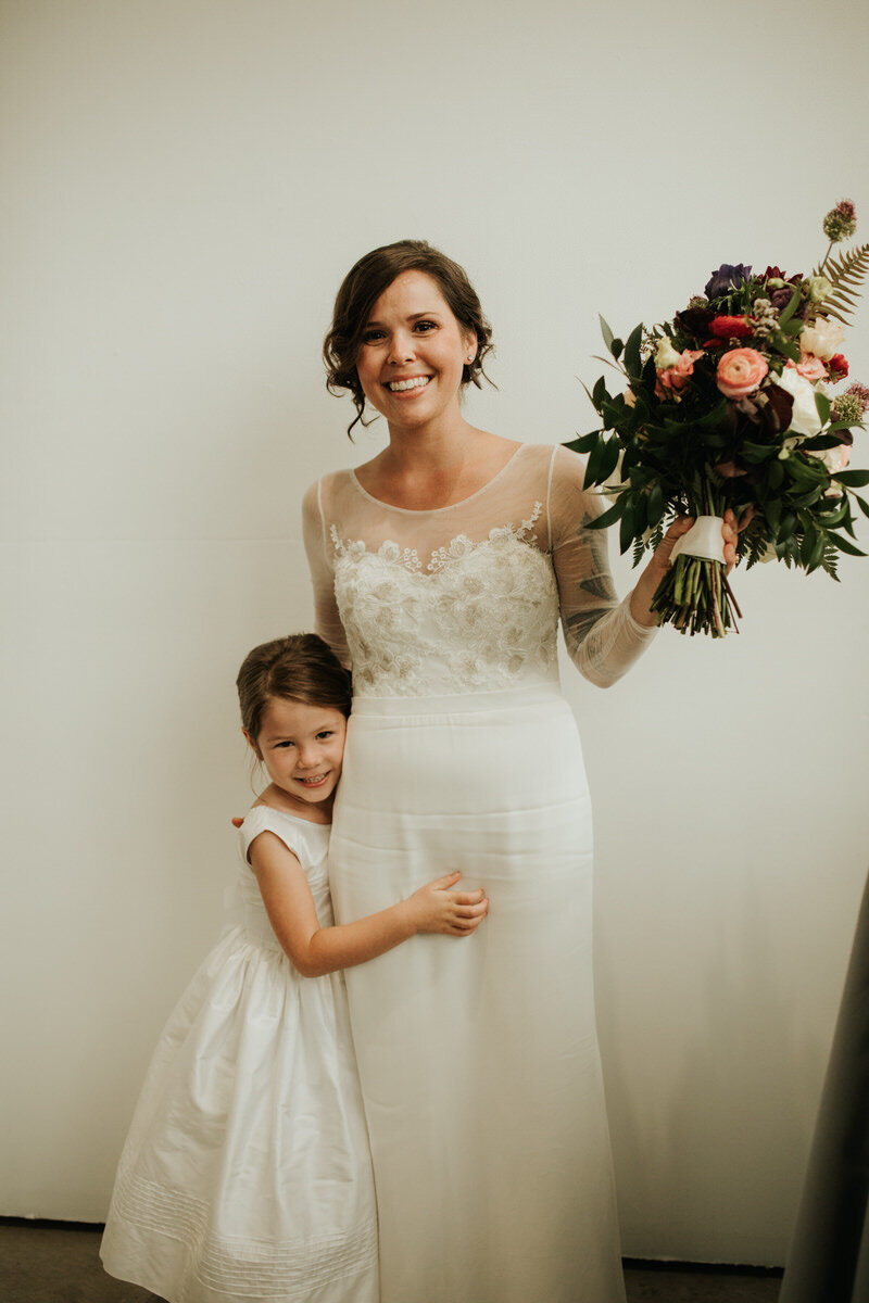 Bride with daughter in Richmond VA Carly Romeo feminist wedding photography