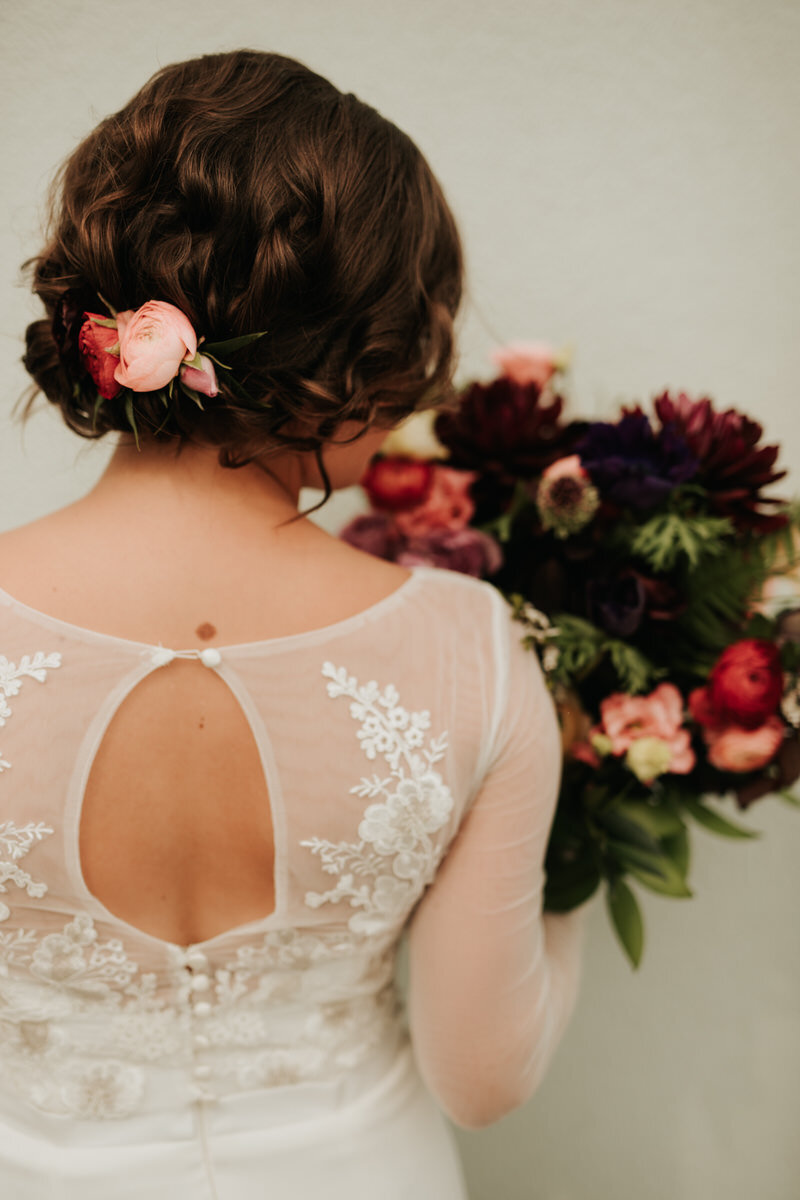 Back of bride in gown with bouquet in Richmond Virginia Carly Romeo &amp; Co.