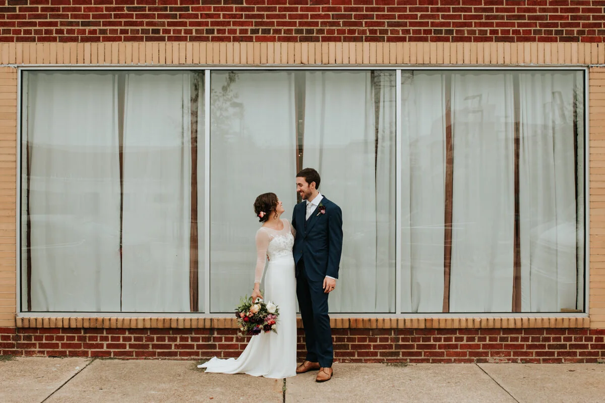 Newly wed partners posing at Studio Two Three Richmond VA Carly Romeo &amp; Co.