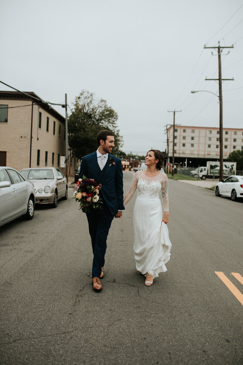 Couple walking down street in Scotts Addition Richmond VA Carly Romeo and Co.