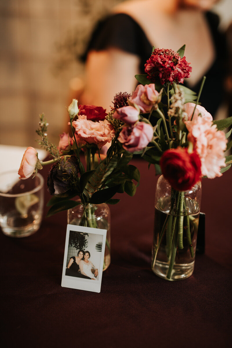 Polaroid and Flowers at Studio Two Three wedding reception in Richmond VA Carly Romeo and Co.