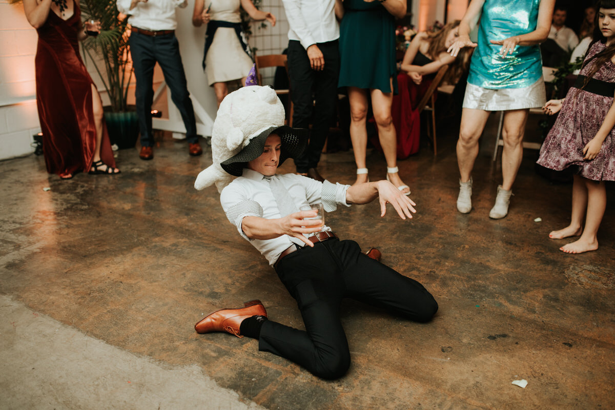 Man with stuffed hat on dance floor at Studio Two Three wedding reception in Richmond Va Carly Romeo photography