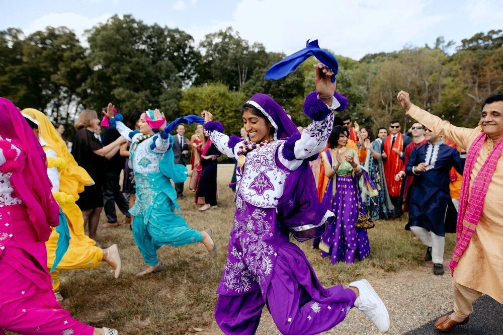 Traditional indian dancers in Baraat ceremony at Dover Hall RVA Carly Romeo photography