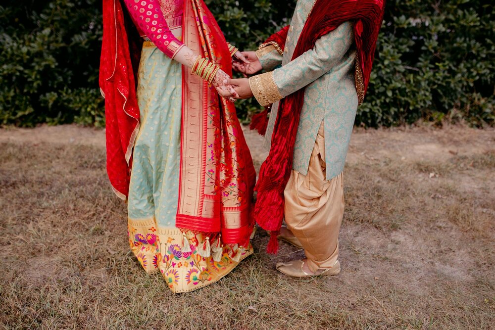 Couple wearing traditional indian wedding dress at Dover Hall Richmond Va Carly Romeo Photography