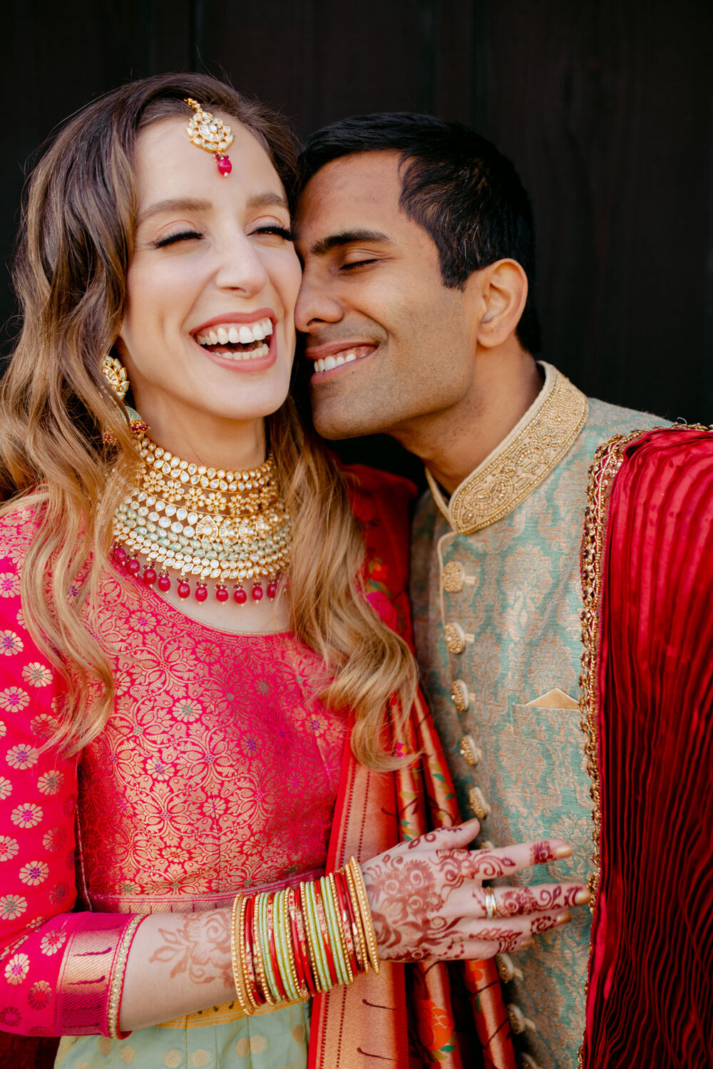 Mixed race couple smiling together in traditional indian wedding attire at Dover Hall Richmond Carly Romeo &amp; Co.