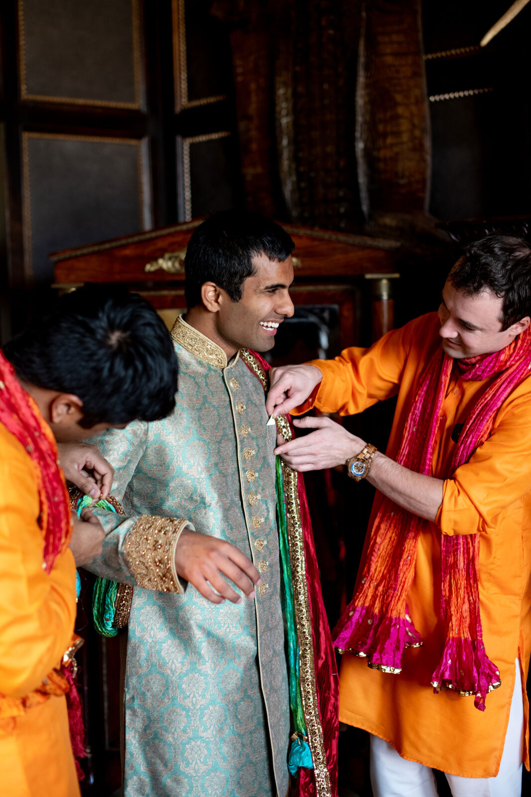 Indian groom getting dressed before wedding at Dover Hall Richmond VA Carly Romeo and Co.