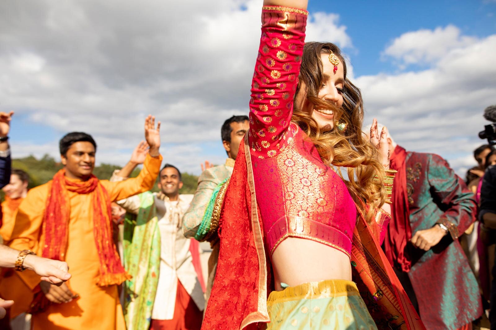 Bride with indian wedding dress in Baraat ceremony at Dover Hall Richmond VA Carly Romeo and Co.