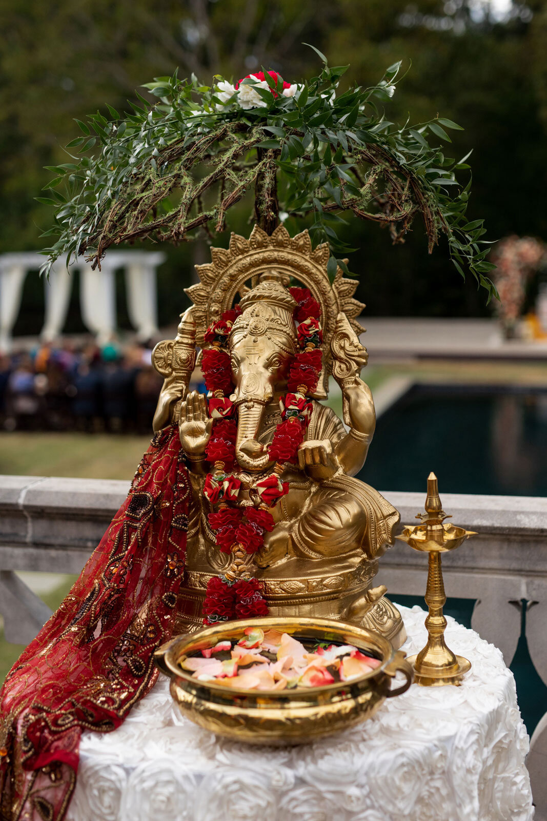 Ganesh sculpture with flowers and petals at indian wedding at Dover Hall Richmond VA Carly Romeo