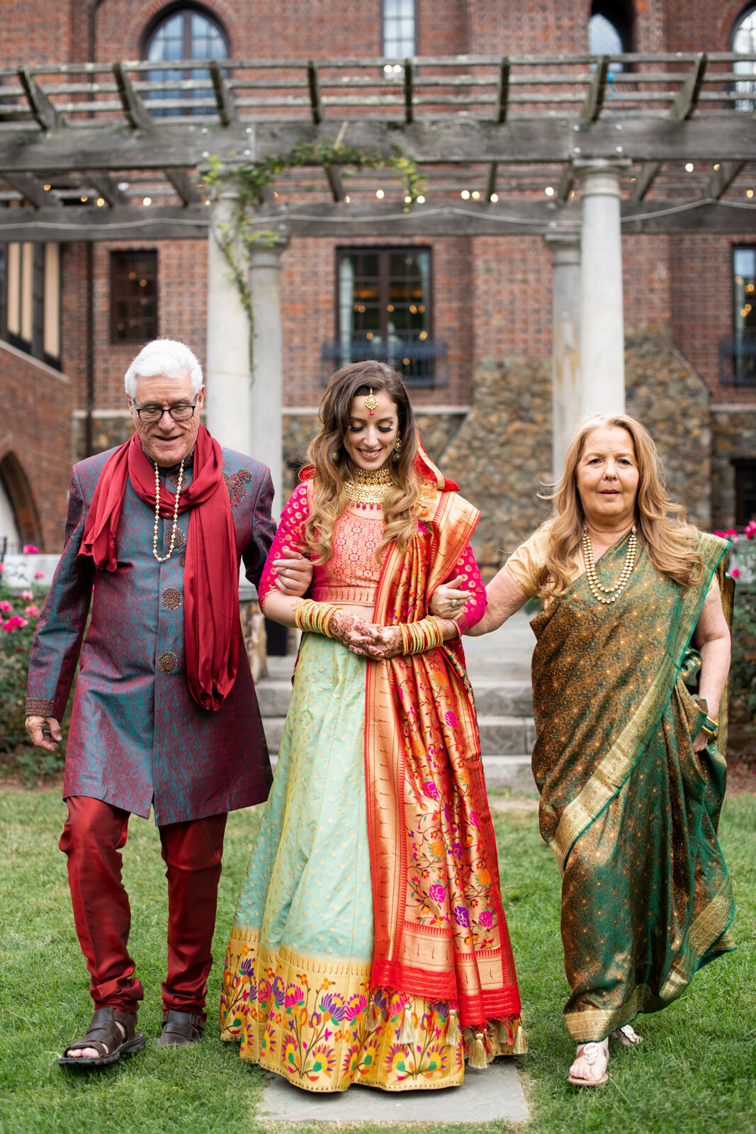 Bride with parents dressed in traditional indian wedding attire at Dover Hall Richmond Va Carly Romeo + CO.