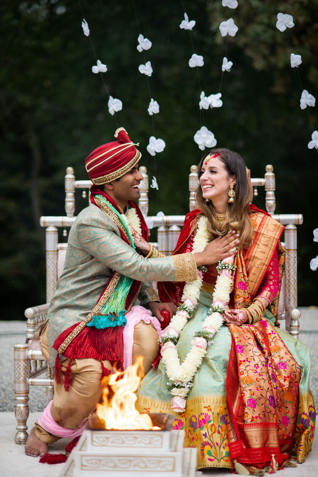Mixed race couple with hand on chest before fire at indian wedding ceremony at Dover Hall RVA Carly Romeo
