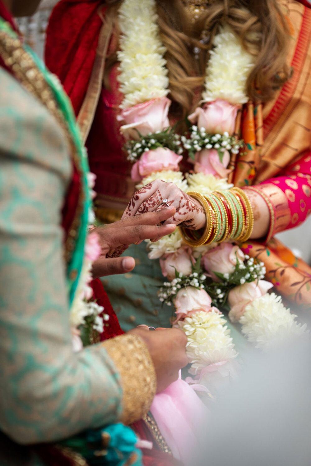 Bride and groom exchanging rings at traditional indian wedding at Dover Hall Richmond VA Carly Romeo &amp; Co.