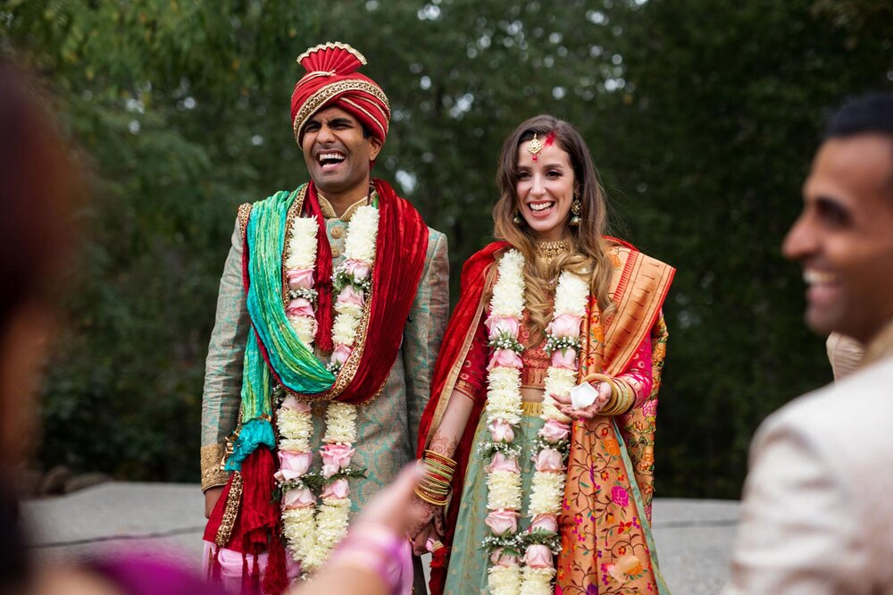 Newlyweds smiling after multicultural indian wedding ceremony at Dover Hall Richmond VA Carly Romeo