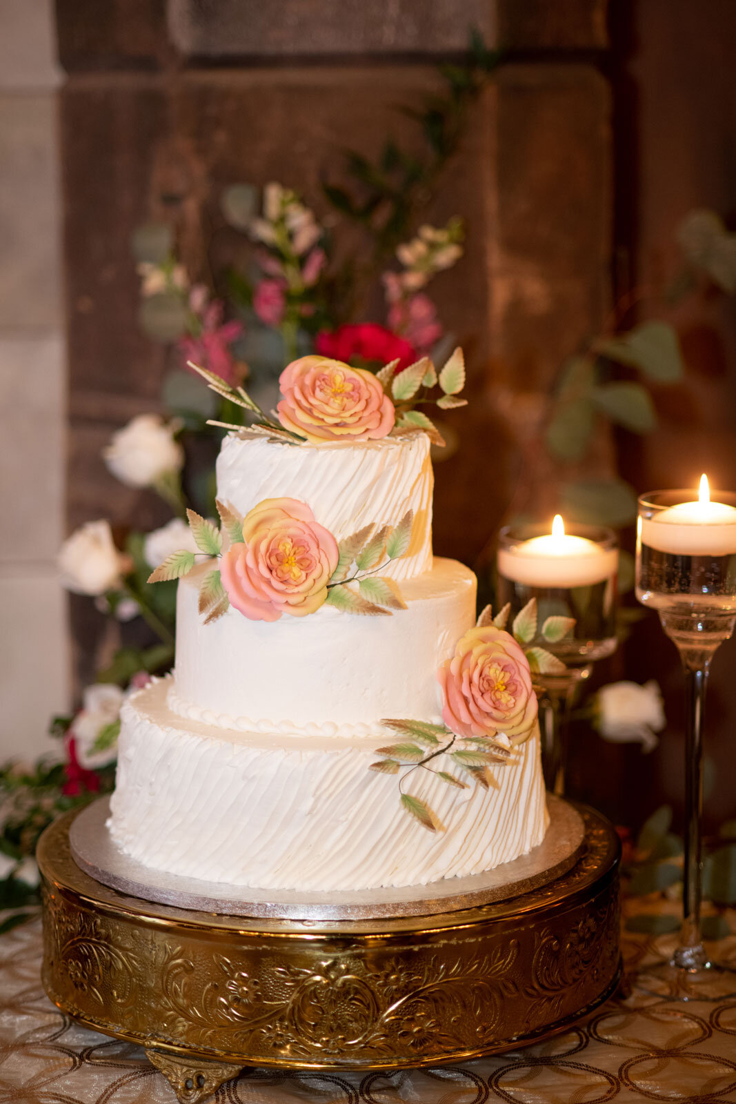 White wedding cake with flowers at Dover Hall outside Richmond VA Carly Romeo photographer