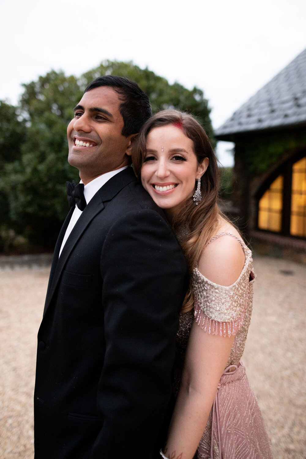 Mixed race bride and groom smiling at Dover Hall RVA Carly Romeo feminist wedding photography