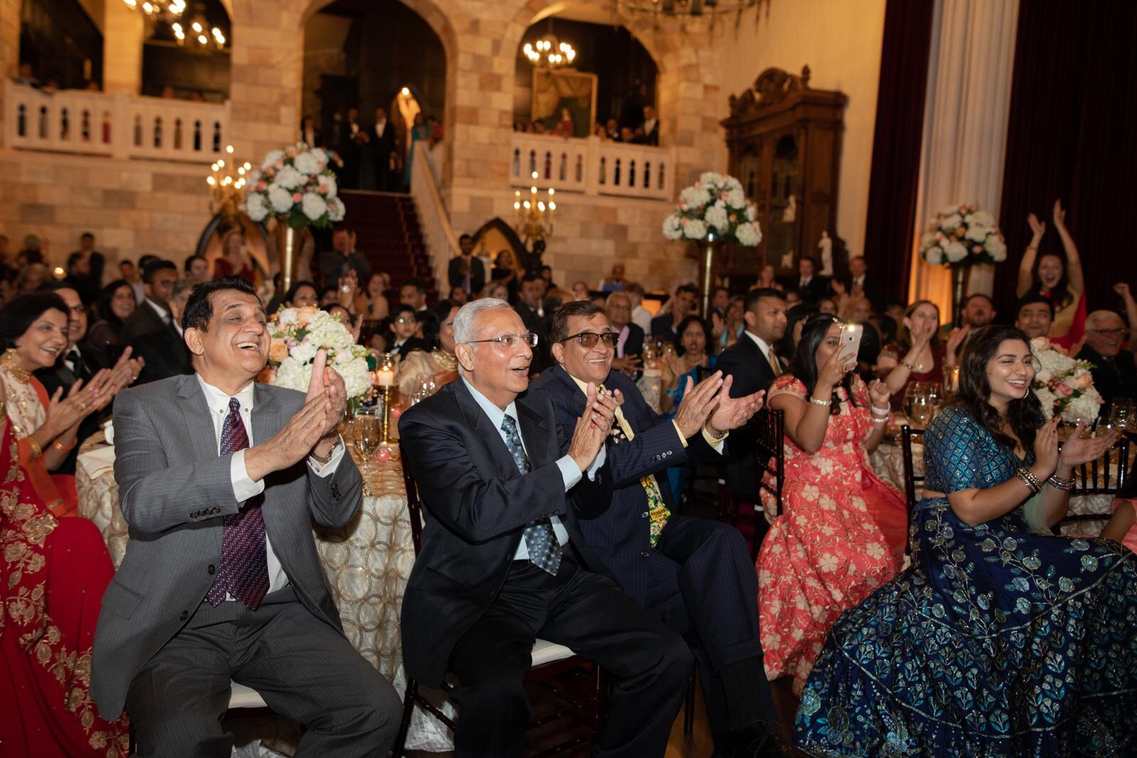 Wedding guests clap at multicultural reception Dover Hall Richmond wedding photography Carly Romeo