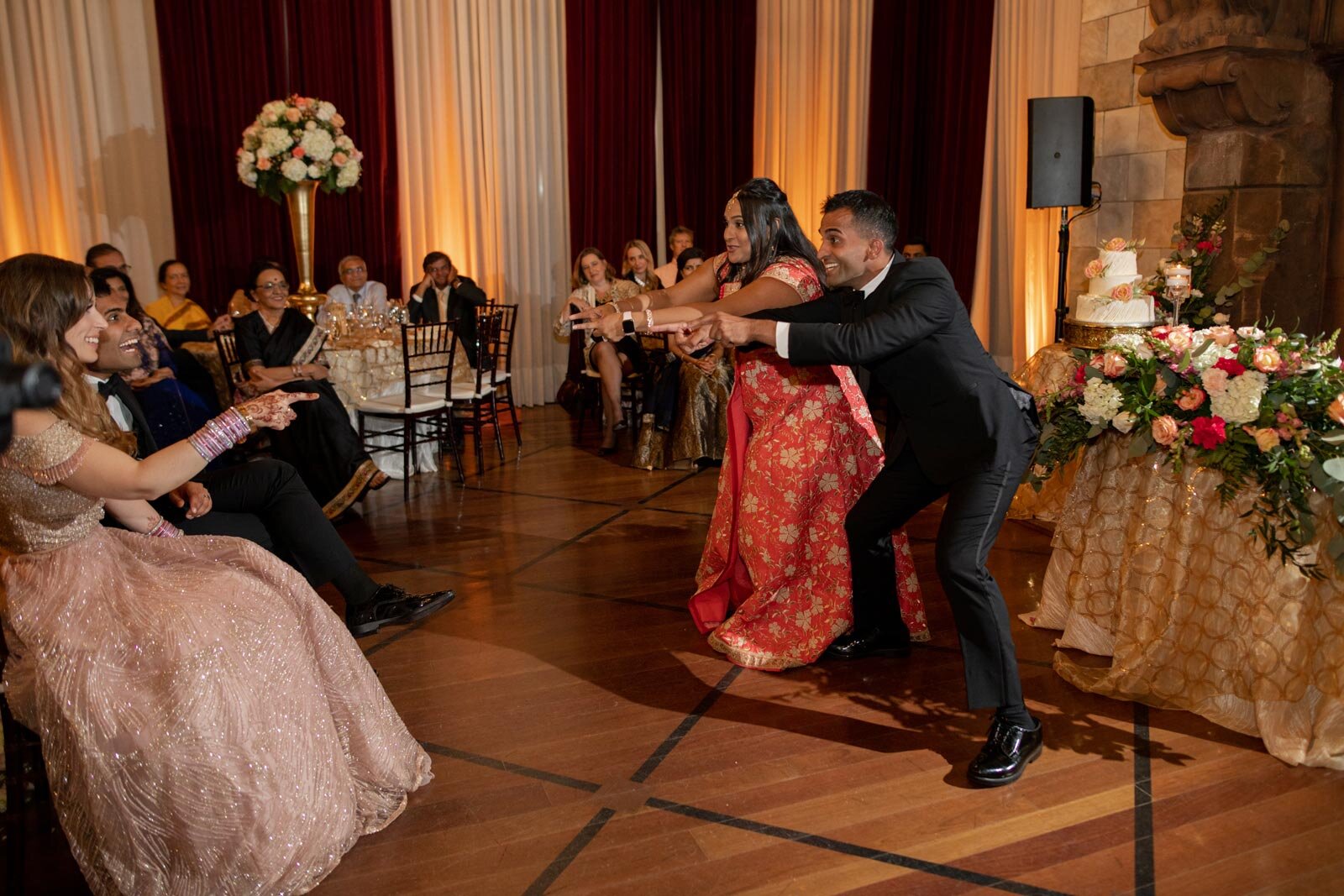 Guests dance for bride and groom at indian wedding reception Dover Hall RVA Carly Romeo