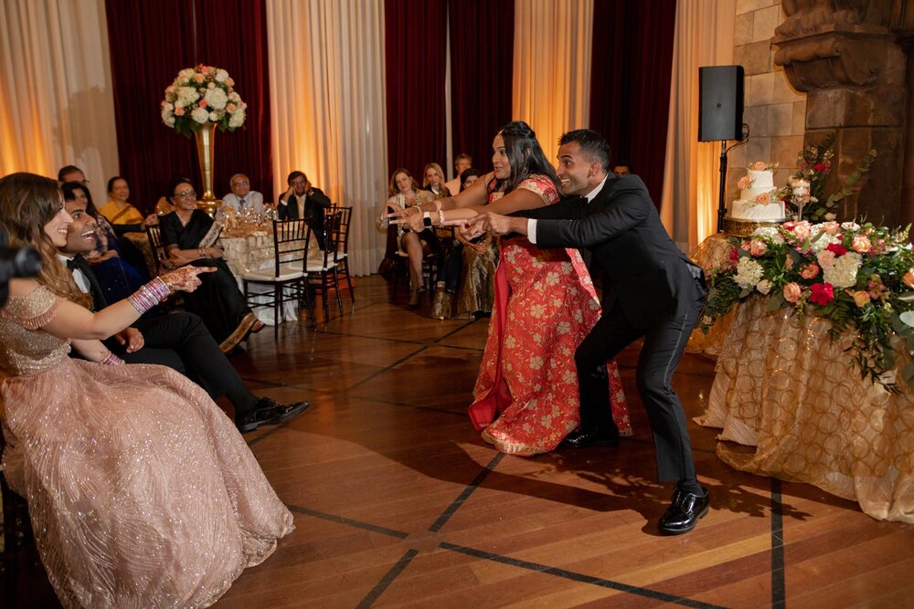 Guests dance for bride and groom at indian wedding reception Dover Hall RVA Carly Romeo