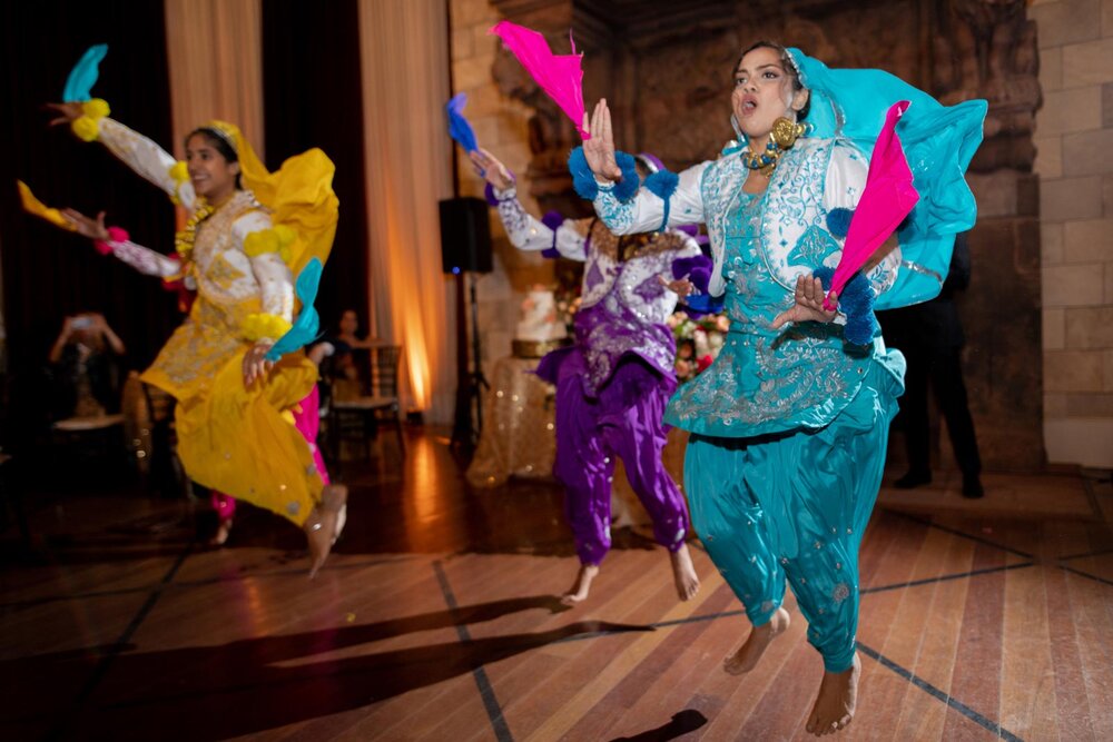 Traditional indian dancers at wedding reception in Dover Hall Richmond VA Carly Romeo and Co.