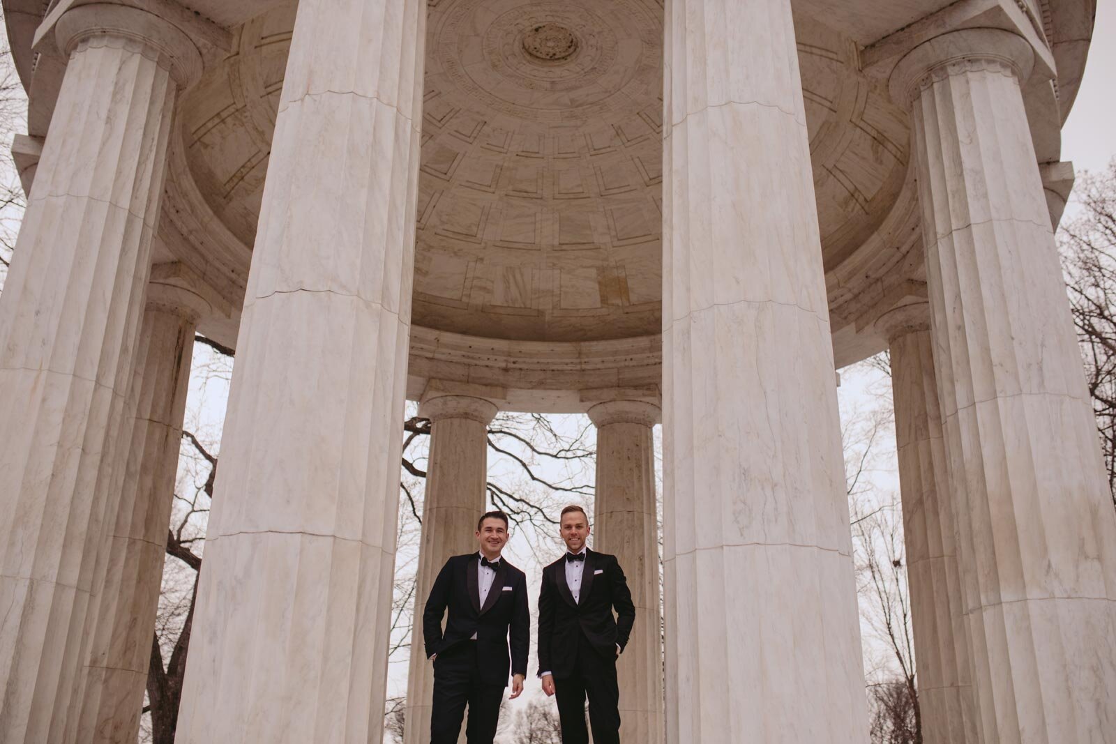 Newlywed gay couple in suits at Washington DC War Memorial Carly Romeo feminist photography