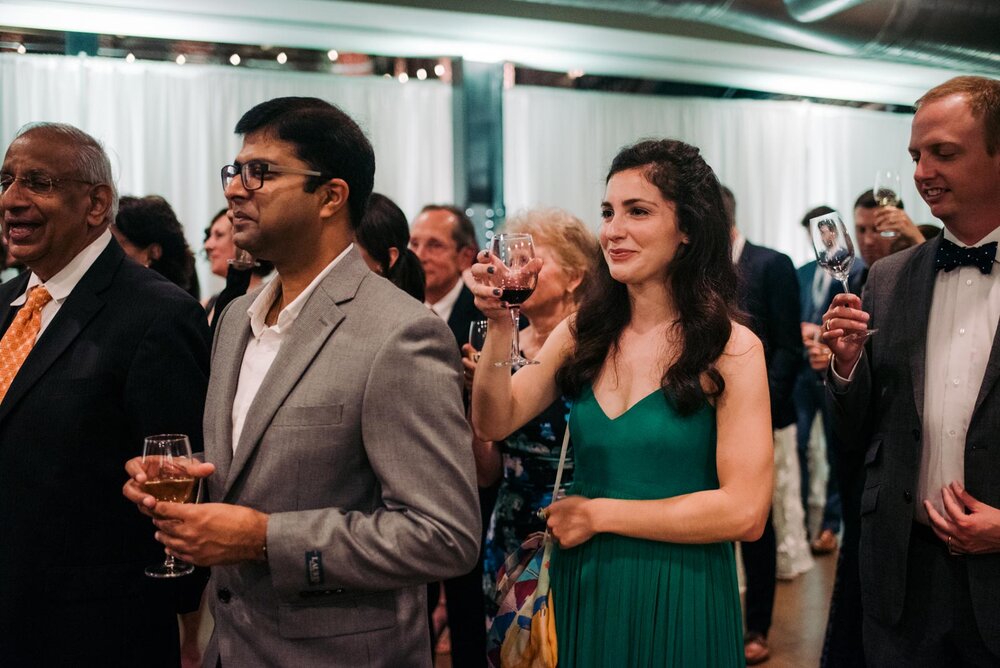 Guests raising their glasses to newlyweds at Pittsburgh Opera wedding PA Carly Romeo + Co.