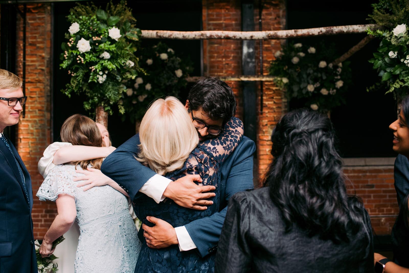 Groom hugging family after wedding ceremony at Pittsburgh Opera PA Carly Romeo and Co.