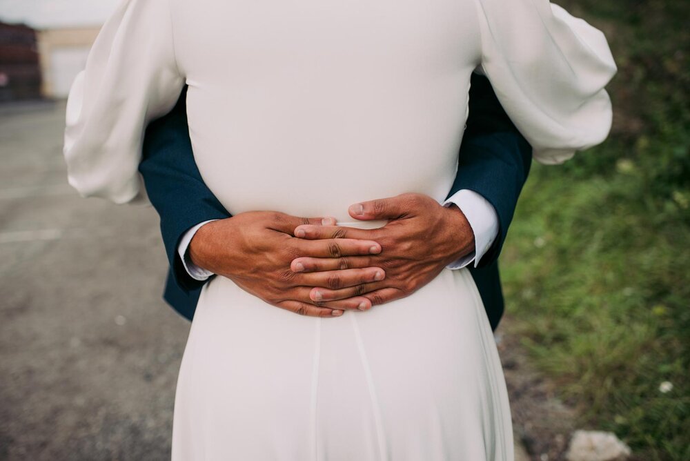 Grooms hands holding bride's back in Pittsburgh PA Carly Romeo wedding photography