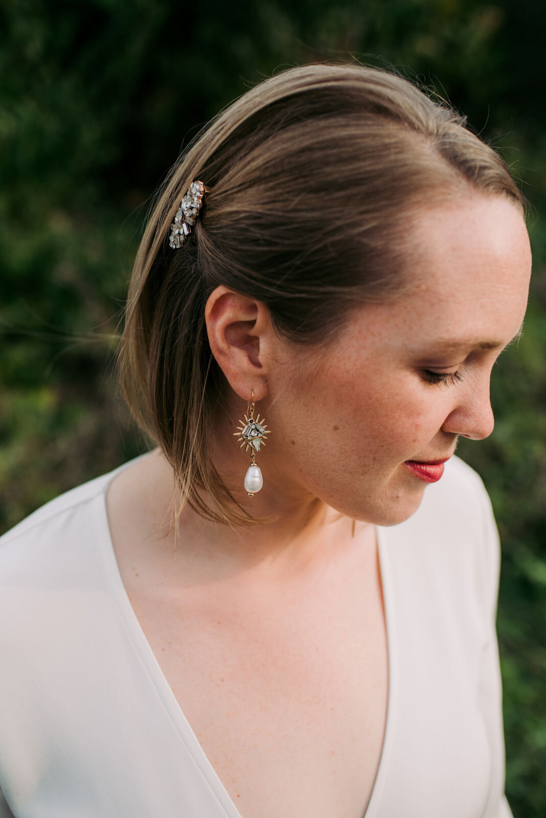Close up of Bride's earring and hair pin in Pittsburgh PA Carly Romeo and Co.