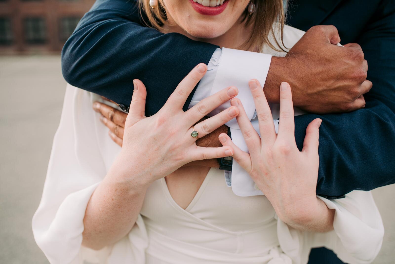 Close up of brides hands in groom's embrace in Pittsburgh PA Carly Romeo and Co.