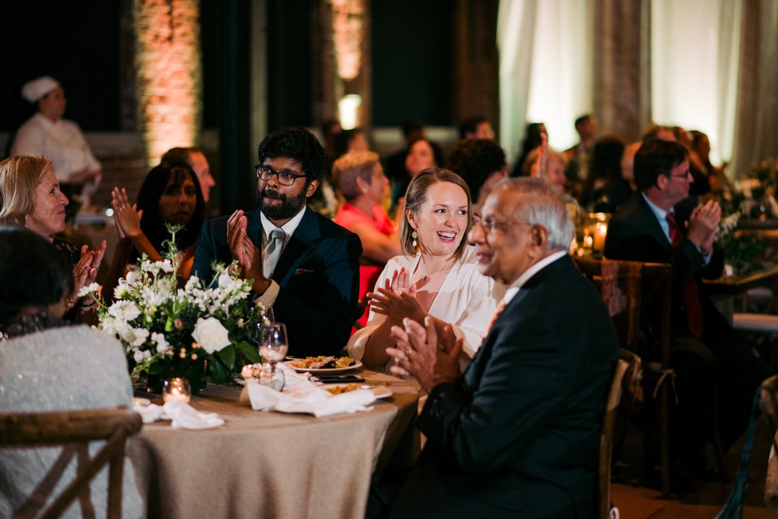 Newlywed couple clapping at reception Pittsburgh Opera PA Carly Romeo and Co.