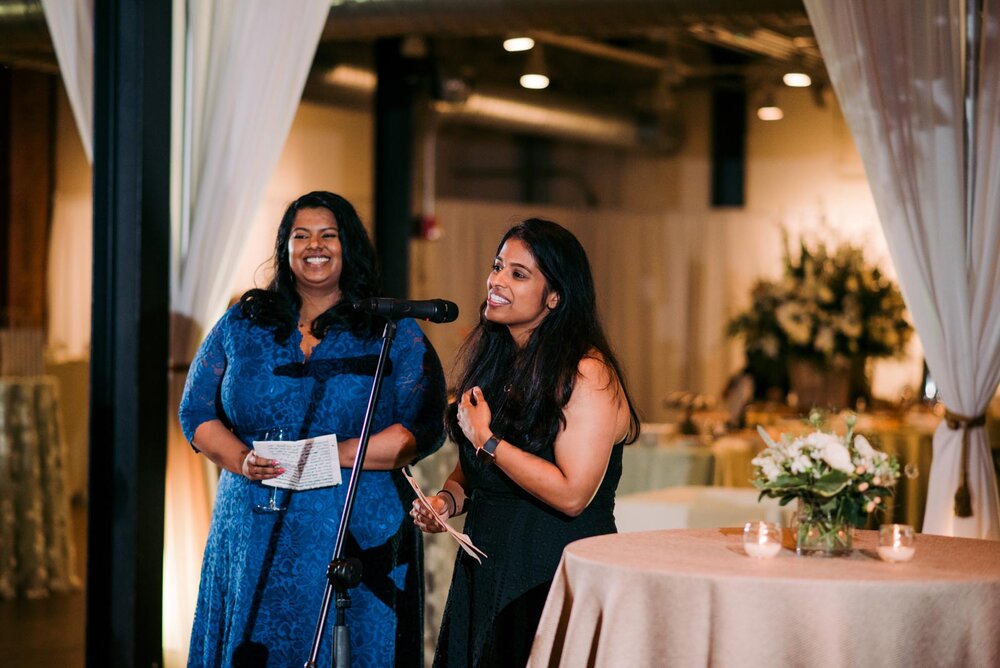 Two women speaking into mic at wedding reception in Pittsburgh Opera PA Carly Romeo and Co