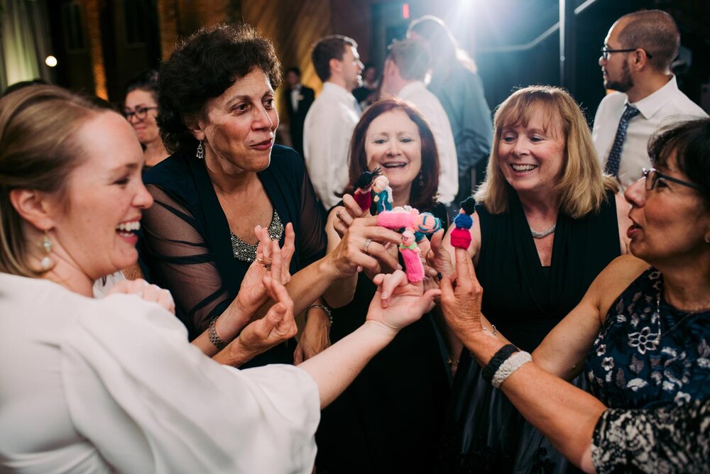 Four female wedding guests and bride with colorful finger puppets in Pittsburgh Opera PA Carly Romeo