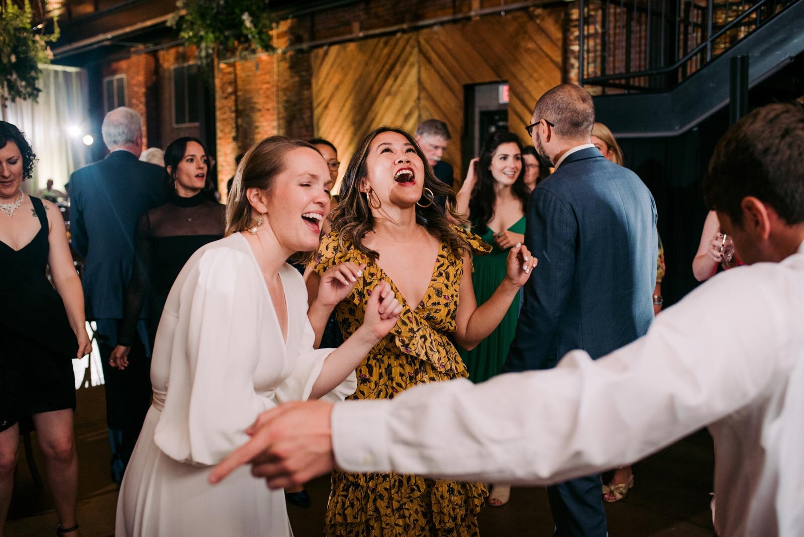 Bride dancing with guests at wedding reception in Pittsburgh Opera PA Carly Romeo photography