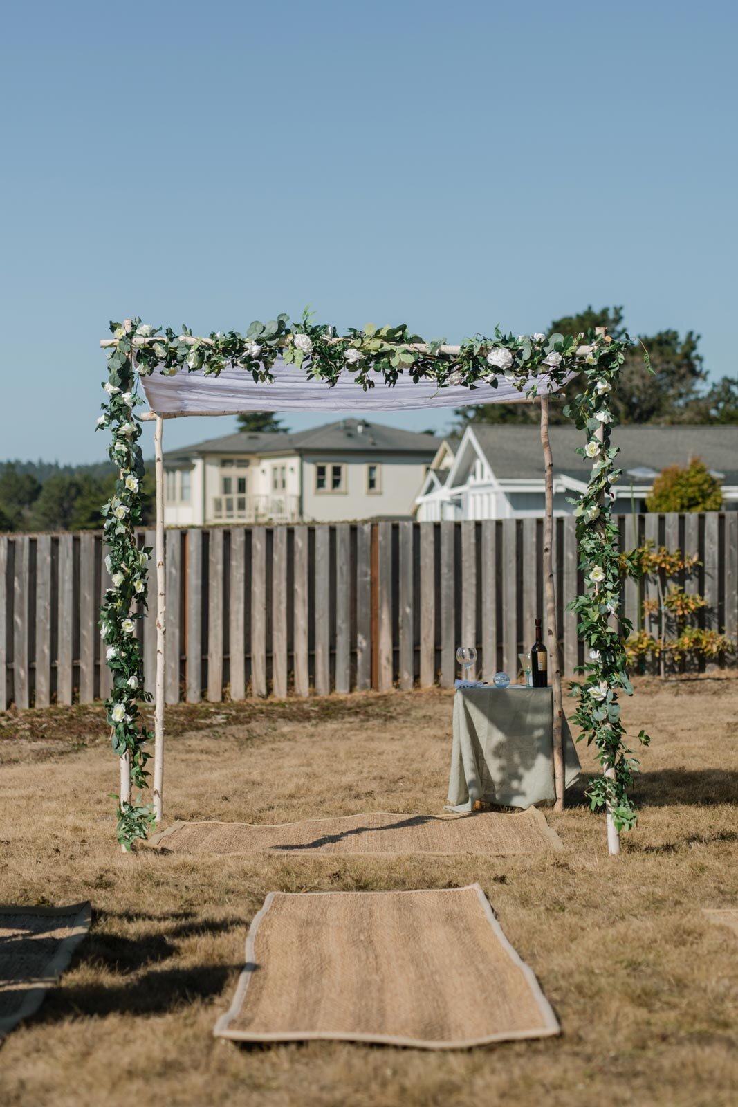 Chuppah with flowers in backyard Mendocino CA Carly Romeo feminist wedding photography