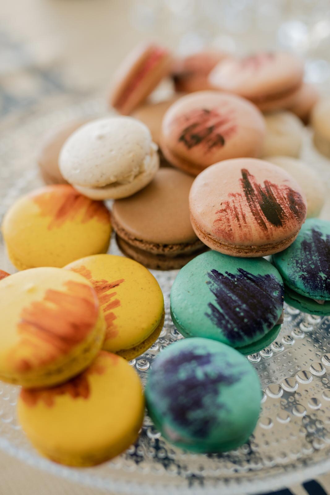 Yellow blue pink and brown macarons in Mendocino CA Carly Romeo wedding photography