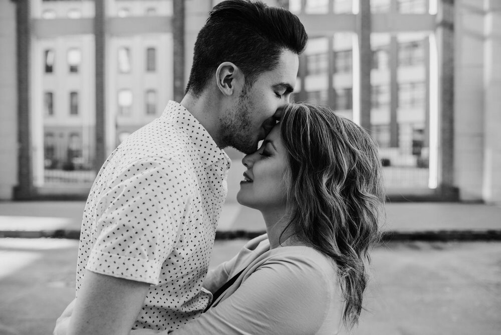 Man kissing woman's forehead in Richmond Virginia Carly Romeo feminist wedding photography (Copy)