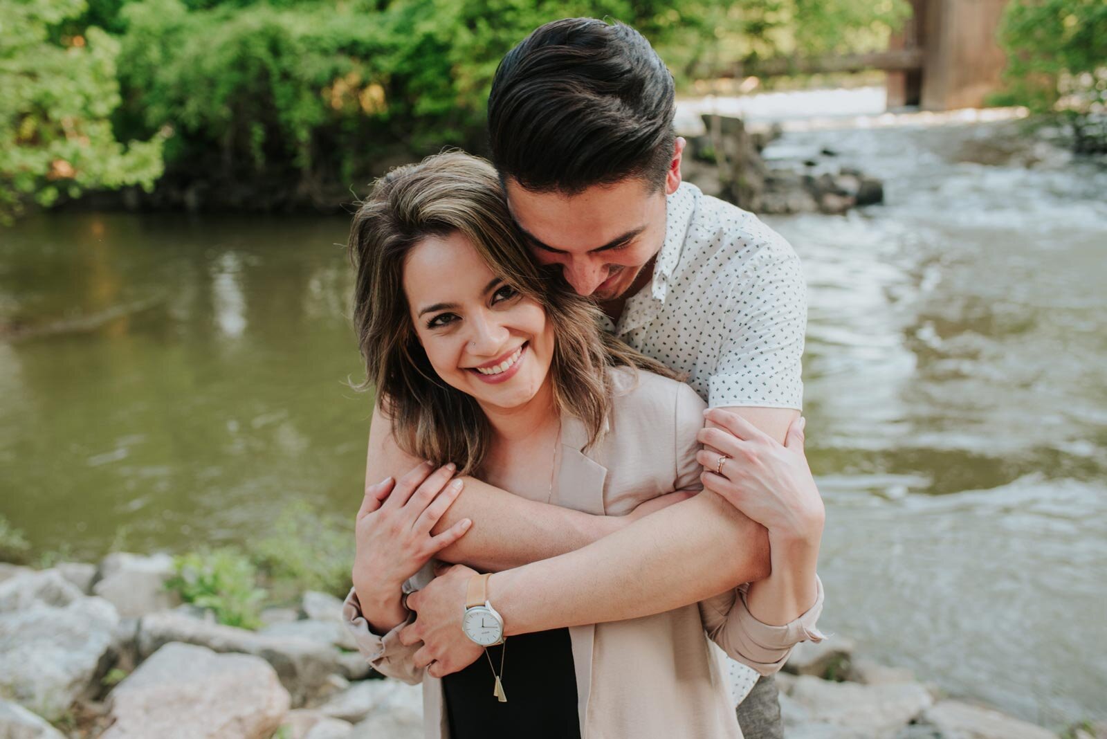 Man holding partner from behind by the James River in Richmond VA Carly Romeo engagement photography (Copy)