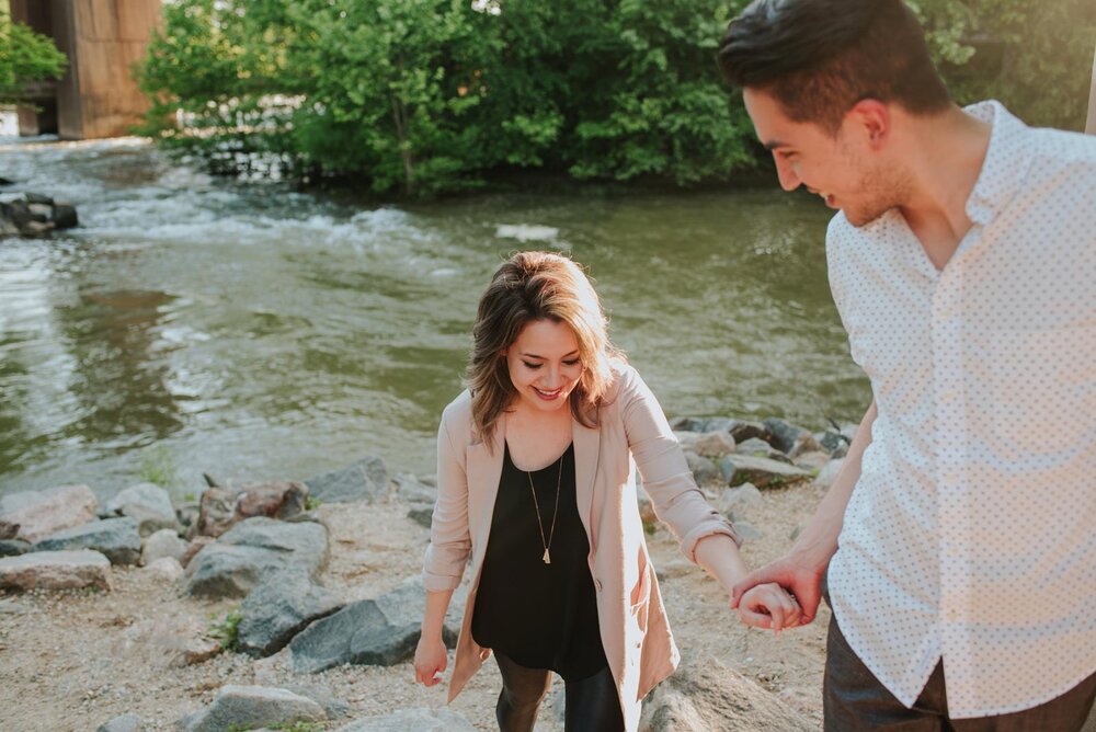 Couple walking through rocks by the James River RVA Engagement shoot Carly Romeo and Co. (Copy)