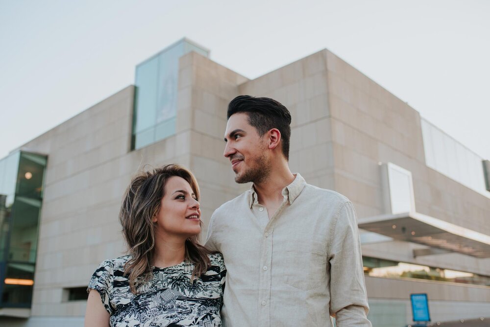 Couple looking into the distance in front of VMFA angular architecture in Richmond VA Carly Romeo (Copy)