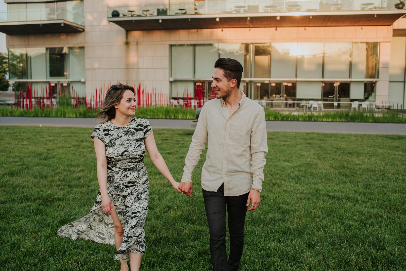 Couple holding hands and looking at each other on lawn behind the Virginia MFA in Richmond Carly Romeo + Co (Copy)