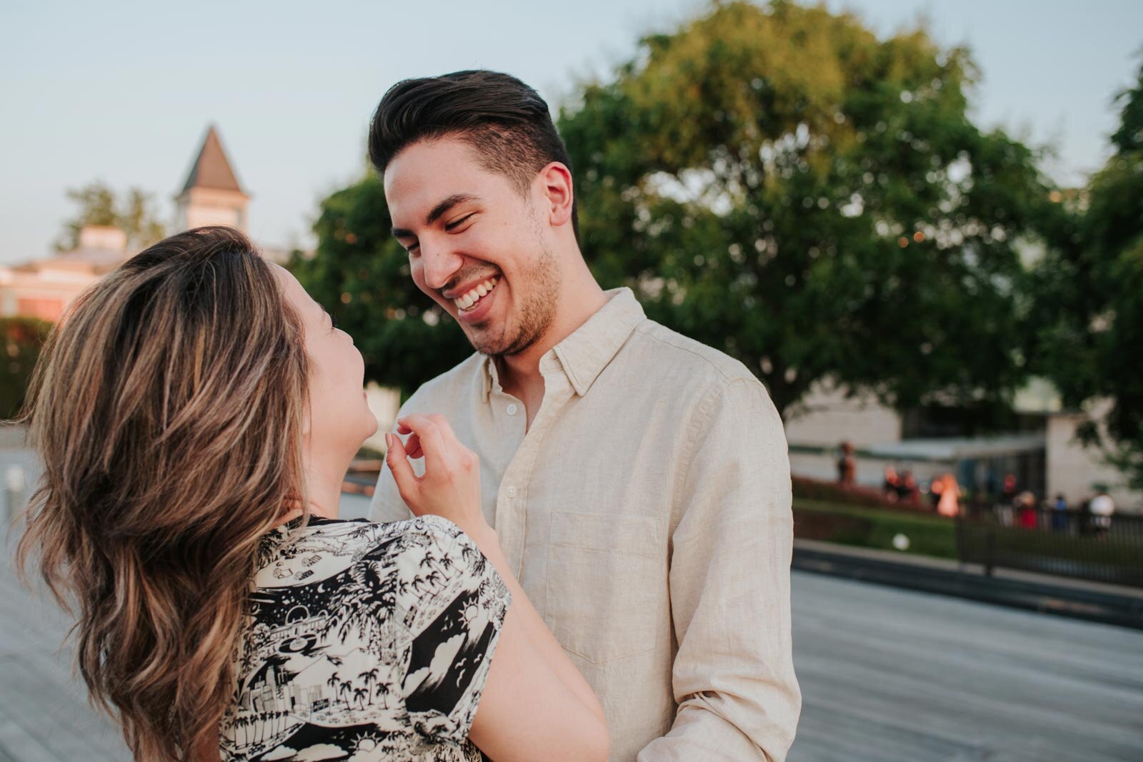 Engaged spouses smiling at each other outside in Richmond VA Carly Romeo feminist photography (Copy)