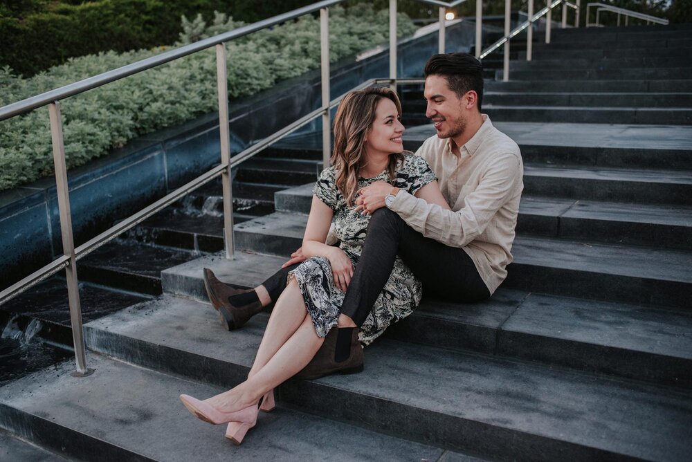 Latinx couple sitting together on the stairs outside the VMFA in Richmond Carly Romeo + CO. (Copy)