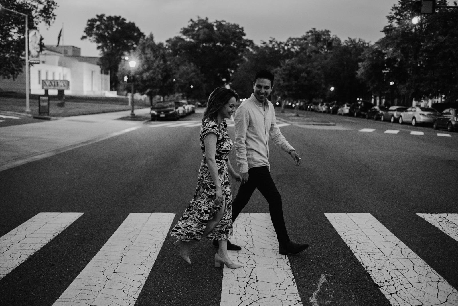 Happy couple walking hand in hand on crosswalk in front of the VMFA in Richmond Carly Romeo and Co (Copy)