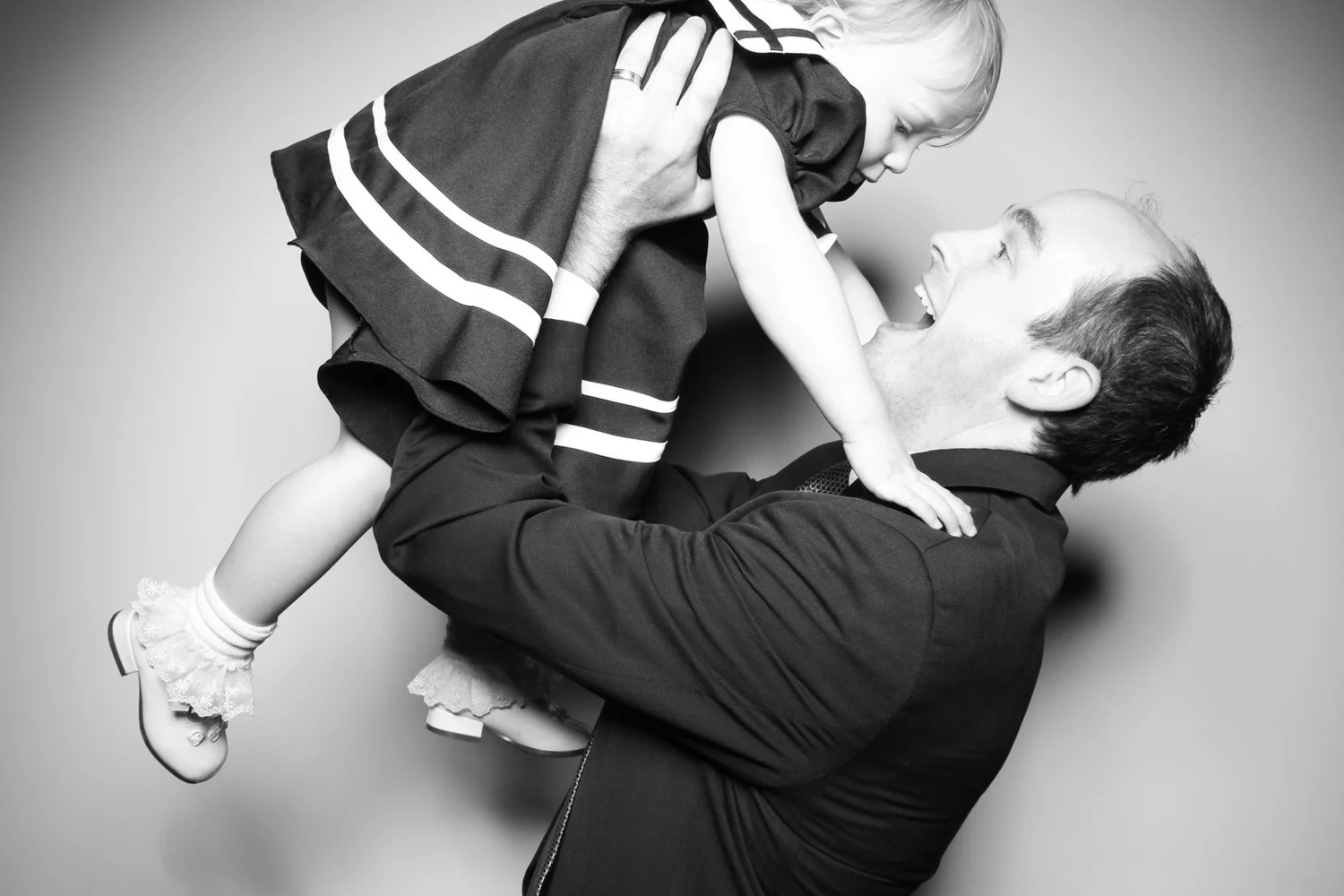Dad and daughter post for a photo booth picture at Bridgeport Art Center.
