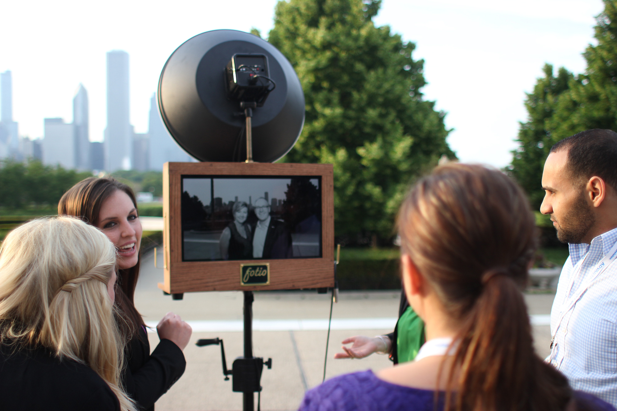 Corporate event guests have fun watching the photo booth slideshow! 